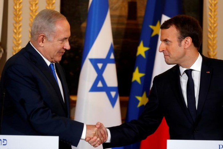 FILE - French President Emmanuel Macron and Israeli Prime Minister Benjamin Netanyahu attend a joint news conference at the Elysee Palace in Paris, France December 10, 2017. REUTERS/Philippe Wojazer 