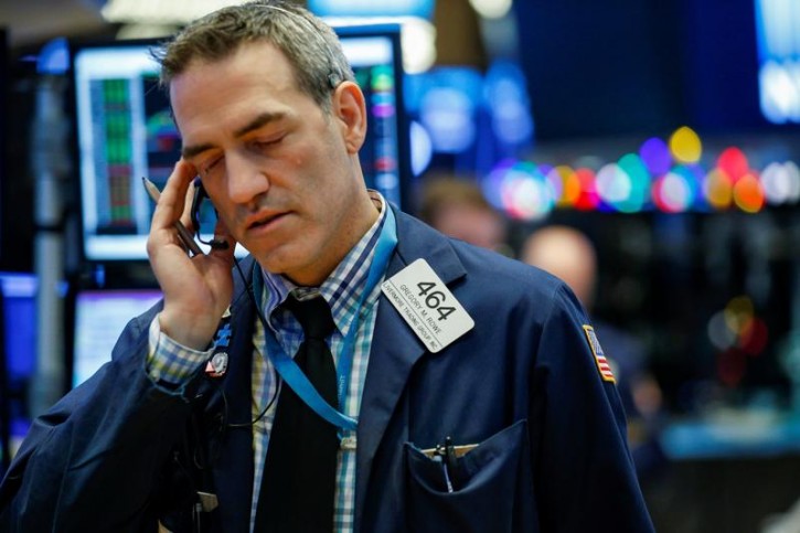 Traders work on the floor of the New York Stock Exchange, (NYSE) in New York, U.S., January 8, 2018. REUTERS/Brendan McDermid 