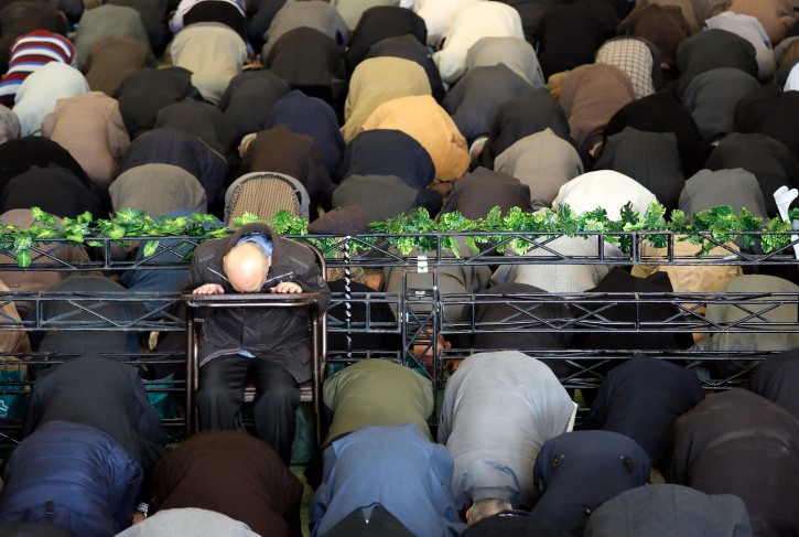  An elderly man sits while others kneel as Iranian worshipers pray during the Friday prayer ceremony at the Imam Khomeini mosque in Tehran, Iran, 05 January 2018. EPA