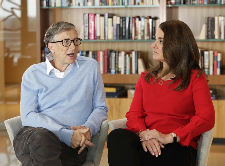 In this Feb. 1, 2018 photo, Microsoft co-founder Bill Gates and his wife Melinda take part in an AP interview in Kirkland, Wash. Gates and his wife head the Bill and Melinda Gates Foundation, and are rethinking their work in America as they confront what they consider an unsatisfactory track record, the country's growing inequity and a president they disagree with more than any other. (AP Photo/Ted S. Warren)