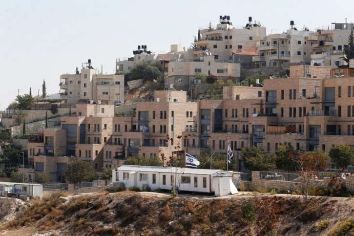 FILE - Buildings forming part of Nof Zion, a Jewish settler enclave, are seen in the foreground as buildings from the Palestinian neighbourhood of Jabel Mukaber are seen in the background, in East Jerusalem October 25, 2017. REUTERS/Ammar Awad 