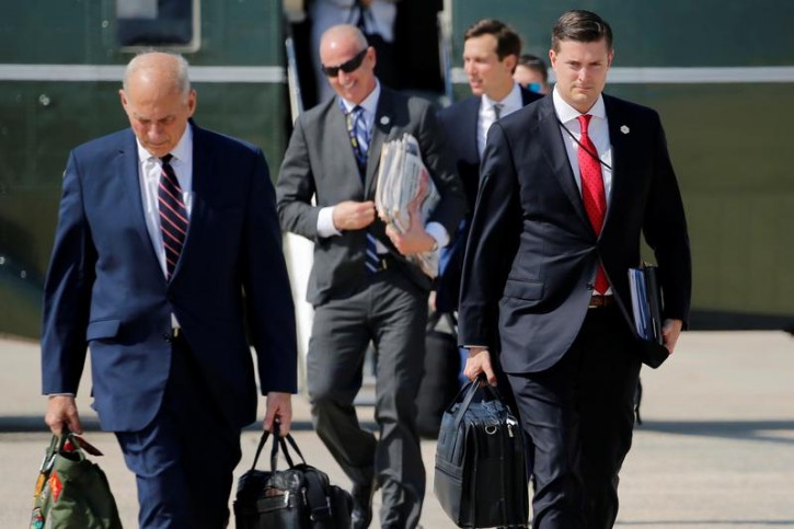 FILE - White House Staff Secretary Rob Porter (R) and White House Chief of Staff John Kelly (L) walk to board Air Force One with U.S. President Donald Trump en route to New Jersey from Joint Base Andrews, Maryland, U.S. August 4, 2017. Picture taken August 4, 2017. REUTERS/Jonathan Ernst 