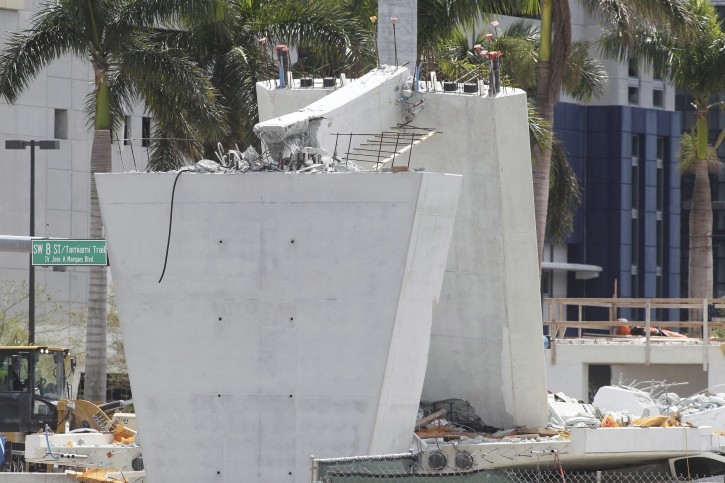 Recovery operations continue Saturday morning, at the site of the FIU-Sweetwater UniversityCity Bridge that collapsed 5 days after been installed over SW 8 Street on Saturday March 17, 2018.