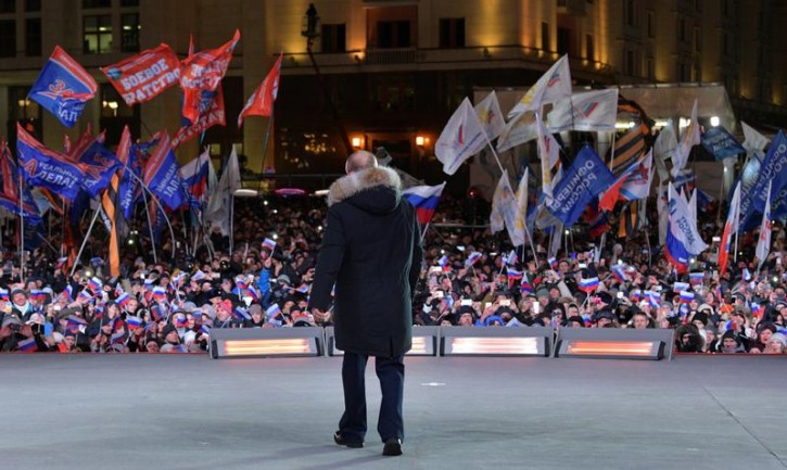 Russian President and Presidential candidate Vladimir Putin attends a rally and concert marking the fourth anniversary of Russia's annexation of the Crimea region, at Manezhnaya Square in central Moscow, Russia March 18, 2018. Sputnik/Alexei Druzhinin/Kremlin via REUTERS