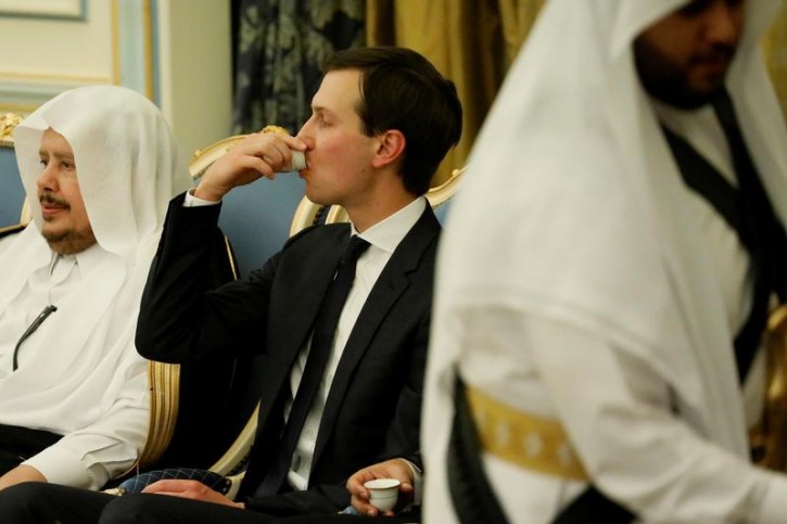 FILE - White House senior advisor Jared Kushner (C) drinks ceremonial coffee during an official welcome for U.S. President Donald Trump and his delegation by Saudi Arabia's King Salman bin Abdulaziz Al Saud (not pictured) at his Royal Court in Riyadh, Saudi Arabia May 20, 2017. REUTERS/Jonathan Ernst 