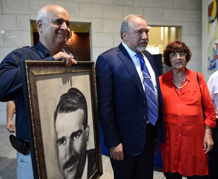 FILE - Defense Minister Avigdor Liberman attends the memorial ceremony forthe late former Mossad agent Eli Cohen, with his widow, Nadia Cohen, on June 20, 2017.