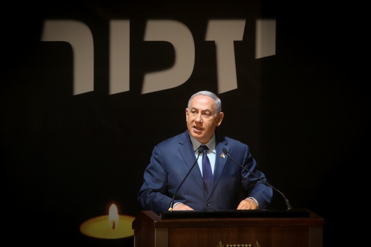 Israeli Prime Minister Benjamin Netanyahu attends the Memorial Day ceremony at Mount Herzl military cemetery in Jerusalem, on Israeli Remembrance Day, which commemorates Israel's fallen soldiers and Israeli civilians killed in terror attacks. April 18, 2018. Photo by Marc Israel Sellem/POOL 