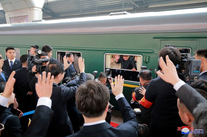 FILE - In this March 27, 2018, file photo provided by the North Korean government, North Korean leader Kim Jong Un, center, waves as he was given a send-off at the Beijing station in Beijing, China. (Korean Central News Agency/Korea News Service via AP, File)