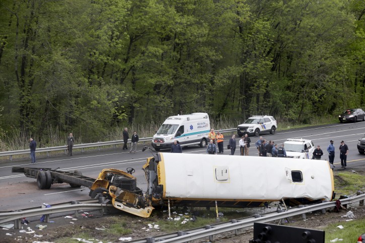 Emergency personnel work at the scene of a school bus crash in Mt. Olive Township, N.J., Thursday, May 17, 2018. (AP Photo/Seth Wenig)