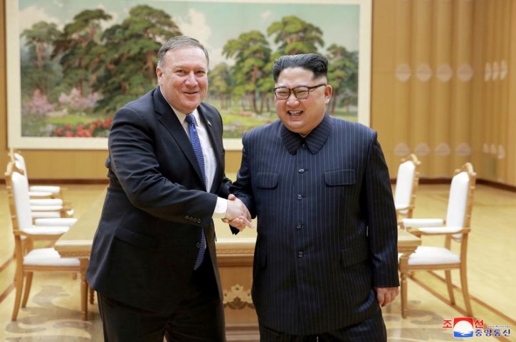 FILE PHOTO: North Korean leader Kim Jong Un shakes hands with U.S. Secretary of State Mike Pompeo in this May 9, 2018 photo released on May 10, 2018 by North Korea's Korean Central News Agency (KCNA) in Pyongyang.   KCNA/via REUTERS 