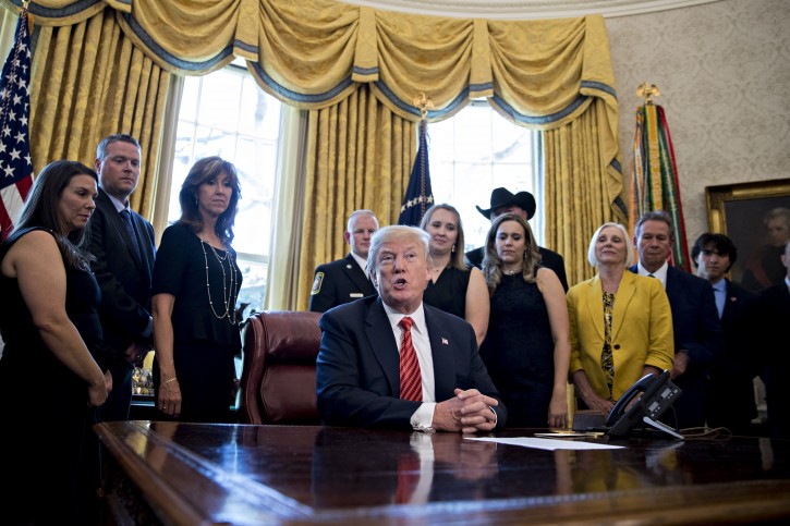 US President Donald Trump, center, speaks as Tammie Jo Shults, a Southwest Airlines Co. captain, third left, and Darren Ellisor, a Southwest Airlines first officer, second left, listen while meeting with the crew and passengers of Southwest Airlines flight 1380 in the Oval Office of the White House in Washington, D.C., USA, 01 May 2018. EPA