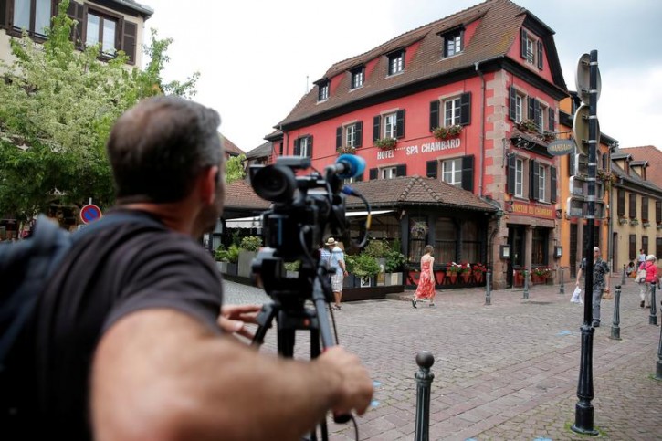 A cameraman works outside Le Chambard Hotel in Kaysersberg-Vignoble, France, June 8, 2018. U.S. celebrity chef Anthony Bourdain, host of CNN's food-and-travel-focused "Parts Unknown" television series, killed himself in a French hotel room, CNN said on June 8, 2018.   REUTERS/Vincent Kessler - 