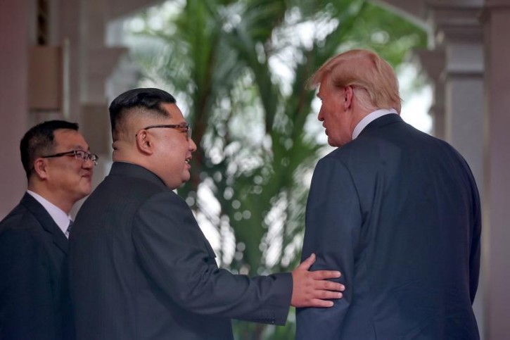 U.S. President Donald Trump meets North Korean leader Kim Jong Un at the Capella Hotel on Sentosa island in Singapore June 12, 2018. Kevin Lim/The Straits Times via REUTERS 