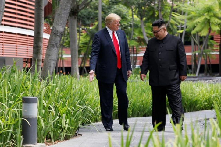 U.S. President Donald Trump and North Korean leader Kim Jong Un walk after lunch at the Capella Hotel on Sentosa island in Singapore June 12, 2018. REUTERS/Jonathan Ernst