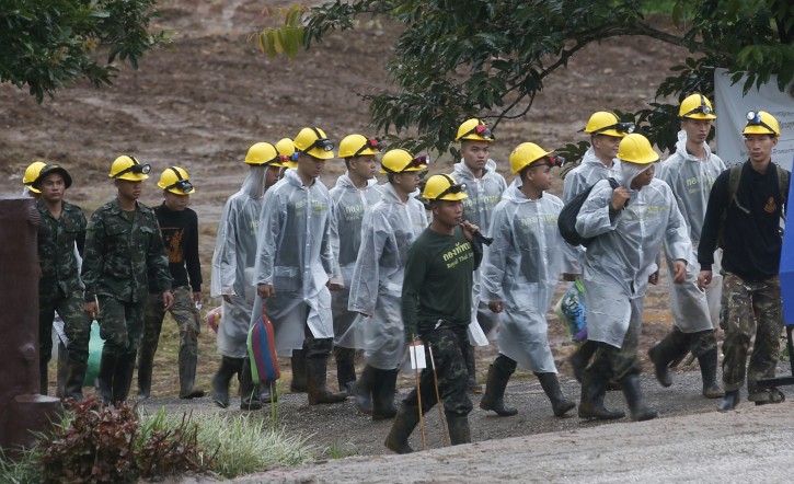 Rescuers makes his way down from the entrance to a cave complex for more evacuations of the boys and their soccer coach who have been trapped since June 23, in Mae Sai, Chiang Rai province, northern Thailand Tuesday, July 10, 2018.  (AP Photo/Sakchai Lalit)
