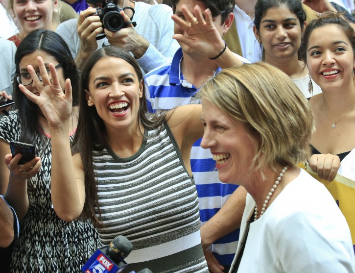 Alexandria Ocasio-Cortez, left, the insurgent who unseated 20-year incumbent Joe Crowley in New York's Congressional District 14, stands next to Zephyr Teachout, after endorsing her candidacy for Attorney General during a press conference, Thursday July 12, 2018, in New York. (AP Photo/Bebeto Matthews)