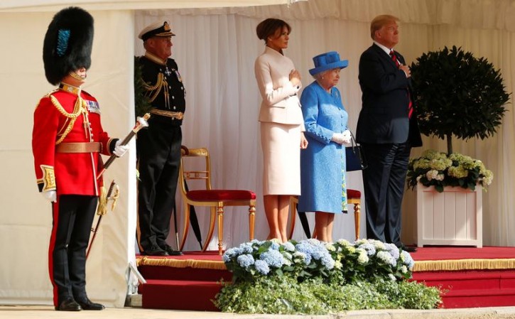 U.S. President Donald Trump and the First Lady Melania Trump are met by Britain's Queen Elizabeth as they arrive for tea at Windsor Castle in Windsor, Britain, July 13, 2018. REUTERS/Kevin Lamarque