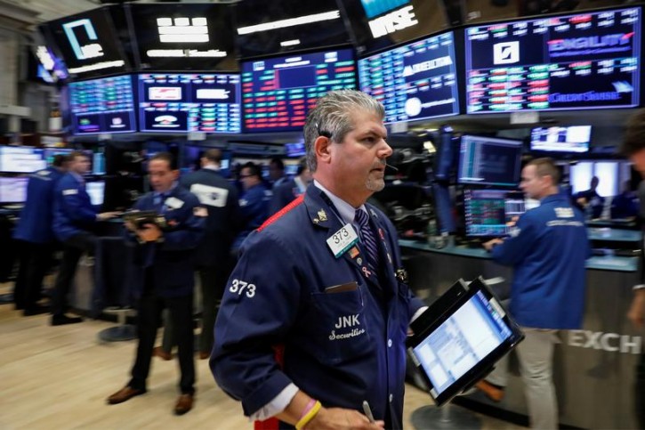 FILE - Traders work on the floor of the New York Stock Exchange (NYSE) in New York, U.S., July 16, 2018. REUTERS/Brendan McDermid