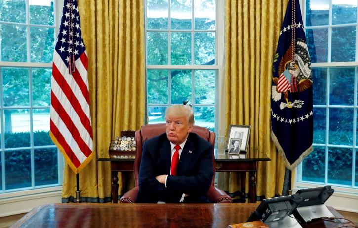 U.S. President Donald Trump reacts to a question during an interview with Reuters in the Oval Office of the White House in Washington, U.S. August 20, 2018.  REUTERS/Leah Millis