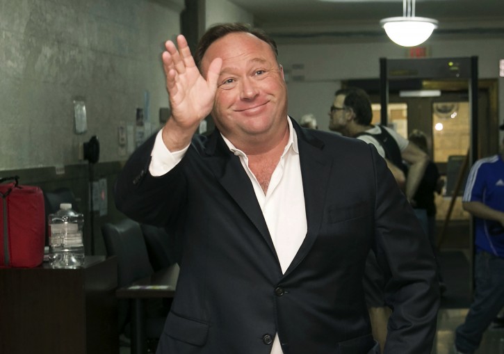 FILE - In this Wednesday, April 19, 2017, file photo, Alex Jones, a right-wing radio host and conspiracy theorist, arrives for a child custody trial at the Heman Marion Sweatt Travis County Courthouse in Austin, Texas. (Jay Janner/Austin American-Statesman via AP, File)