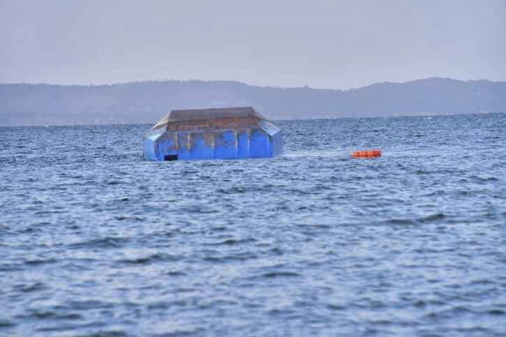 The upturned passenger ferry MV Nyerere floats in the water near Ukara Island in Lake Victoria, Tanzania Friday, Sept. 21, 2018. AP