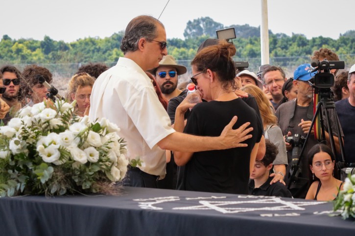 Family and friends mourn near the coffin of 17-year-old Ari Nesher during the funeral in Moshav Udim cemetery, Sunday, September 30, 2018. Ari Nesher was was injured and later died from his wounds at a hit-and-run accident last week in Tel Aviv. Photo by Roy Alima/Flash90