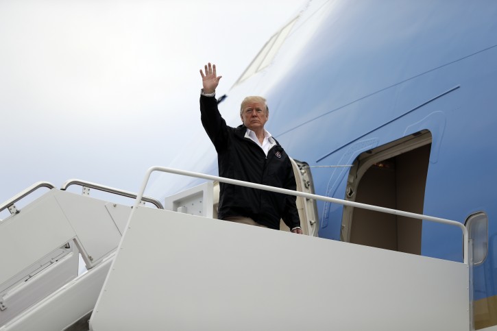 President Donald Trump boards Air Force One for a trip to visit areas impacted by the California wildfires, Saturday, Nov. 17, 2018, in Andrews Air Force Base, Md. (AP Photo/Evan Vucci)