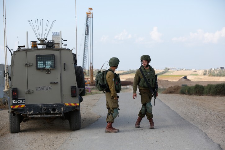 Israeli soldiers block a road near the border with Gaza southern Israel, 12 November 2018. EPA