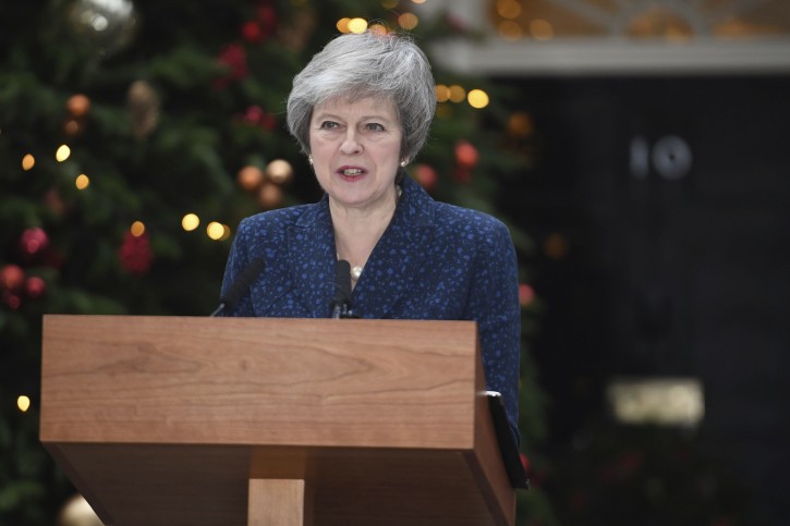 Britain's Prime Minister Theresa May makes a media statement in Downing Street, London, confirming there will be a vote of confidence in her leadership of the Conservative Party, Wednesday Dec. 12, 2018.  The vote of confidence will be held in Parliament Wednesday evening, with the result expected to be announced soon after. (Stefan Rousseau/PA via AP)