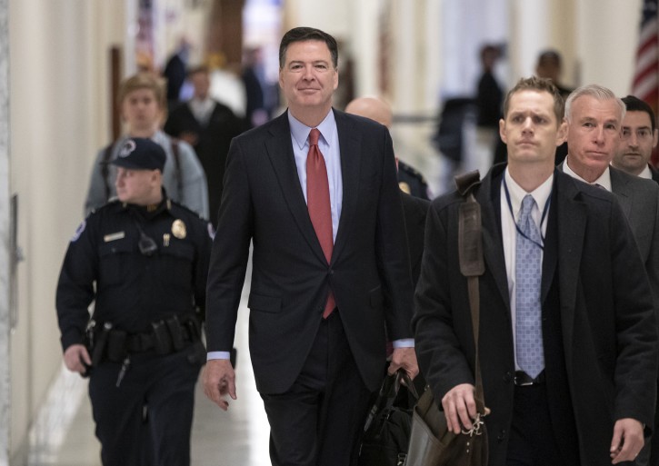 Former FBI Director James Comey arrives on Capitol Hill to testify under subpoena in a second closed-door interview with the GOP-led House Judiciary and Oversight Committees in their probe of conduct by federal law enforcement officials in the investigation of President Trum's alleged Russia ties, and Hillary Clinton's emails, in Washington, Monday, Dec. 17, 2018.  (AP Photo/J. Scott Applewhite)