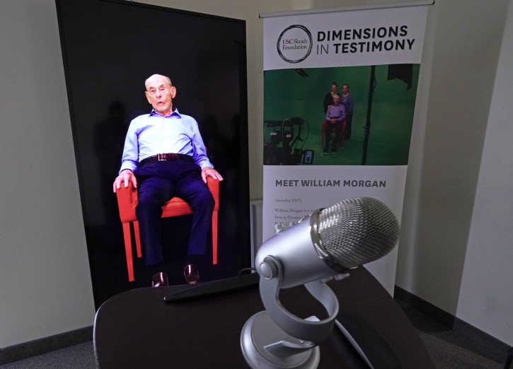 A Demensions in Testimony exhibit featuring Holocaust survivor William Morgan using an interactive virtual conversation is shown at the the Holocaust Museum Houston Friday, Jan. 11, 2019, in Houston. The University of Southern California Shoah Foundation has recorded 18 interactive testimonies with Holocaust survivors over the last several years. (AP Photo/David J. Phillip)