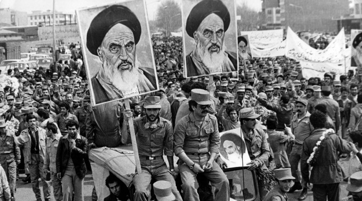The Iranian Islamic Republic Army demonstrates in solidarity with people in the street during the Iranian revolution. They are carrying posters of the Ayatollah Khomeini, the Iranian religious and political leader.   (Photo by Keystone)