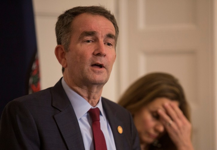 Virginia Governor Ralph Northam, accompanied by his wife Pamela Northam announces he will not resign during a news conference Richmond, Virginia, U.S. February 2, 2019. REUTERS/ Jay Paul