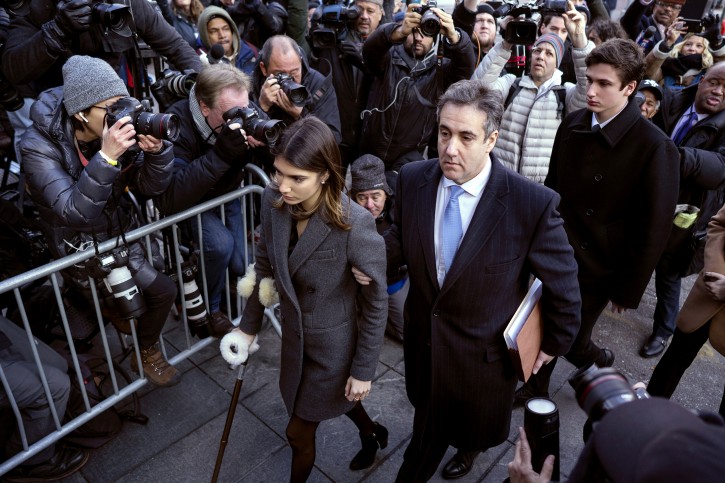FILE - In this Dec. 12, 2018, file photo, Michael Cohen, center, President Donald Trump's former lawyer, accompanied by his children Samantha, left, and Jake, right, arrives at federal court for his sentencing in New York.   (AP Photo/Craig Ruttle, File)