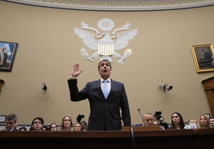 Michael Cohen, President Donald Trump's former personal lawyer, is sworn in to testify before the House Oversight and Reform Committee about his behind-the-scenes knowledge of Trump's activities, including possible criminal conduct, on Capitol Hill in Washington, Wednesday, Feb. 27, 2019. AP
