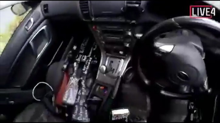 This image taken from the alleged shooter’s video, which was filmed Friday, March 15, 2019, shows a gun in his vehicle in New Zealand. (AP Photo)