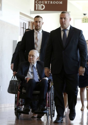 Former U.S. Senator Harry Reid, who sued the makers of an exercise band after injuring his eye, leaves the courtroom after attending the first day of jury selection in his civil trial at the Regional Justice Center on Monday, March. 25, 2019, in Las Vegas. (Bizuayehu Tesfaye/Las Vegas Review-Journal via AP)