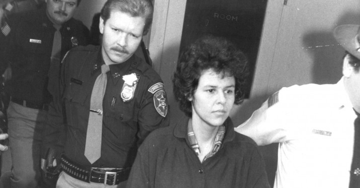 FILE - In this Nov. 24, 1981 file photo, Weather Underground member Judith Clark is handcuffed as she is escorted into Rockland County Courthouse, in New City, N.Y.  (AP Photo/David Handschuh, File)
