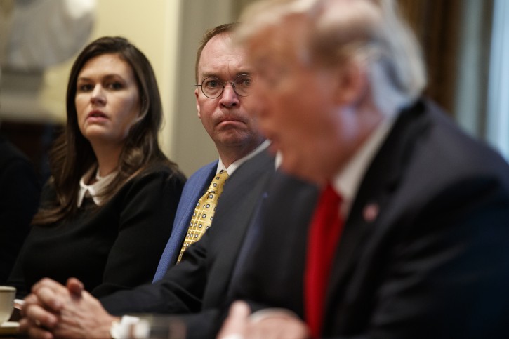 White House press secretary Sarah Sanders and acting White House Chief of Staff Mick Mulvaney listen as President Donald Trump speaks during a meeting with NATO Secretary General Jens Stoltenberg in the Cabinet Room of the White House, Tuesday, April 2, 2019, in Washington. (AP Photo/Evan Vucci)