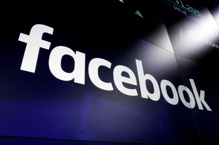 FILE - In this file photo dated March 29, 2018,  the logo for social media giant Facebook, appears on screens at the Nasdaq MarketSite, in New York's Times Square.  (AP Photo/Richard Drew, FILE)