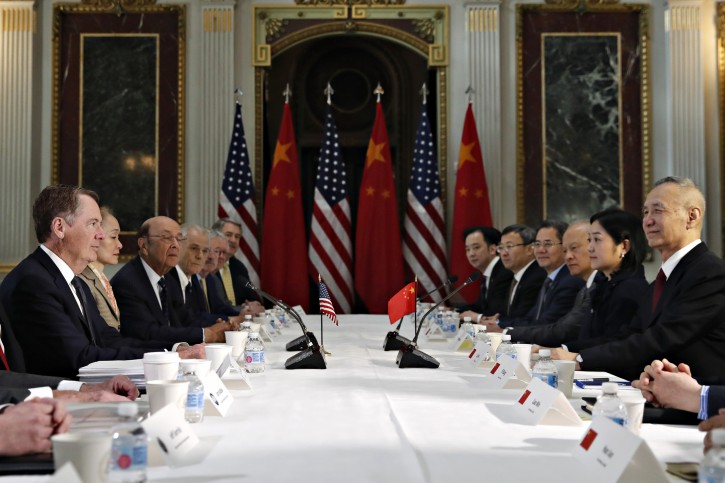 FILE - U.S. Trade Representative Robert Lighthizer, left, and Chinese Vice Premier Liu He, right, attend a meeting of senior U.S. and Chinese officials to resume trade negotiations, Thursday, Feb. 21, 2019, in the Indian Treaty Room of the Eisenhower Executive Office Building at the White House complex, in Washington. (AP Photo/Jacquelyn Martin)