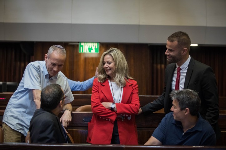 New Knesset members Yoaz Hendel, Yorai Lahav Hertzano, Miki Haimovich (C), Chili Tropper, Zvi Hauser seen at the Knesset Plenary Hall, ahead of the opening Knesset session of the new government, on April 29, 2019. Photo by Noam Revkin Fenton/Flash90