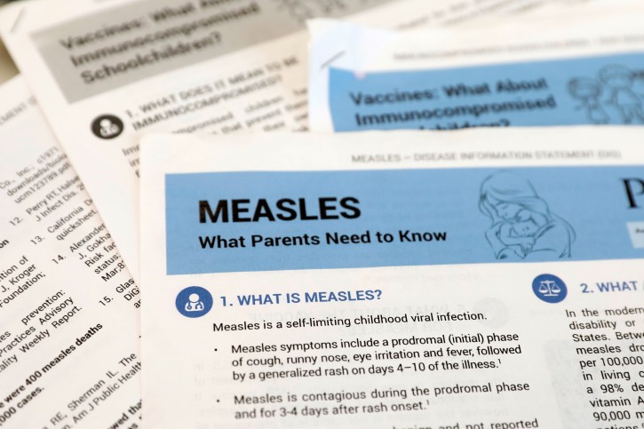FILE - Materials are seen left at demonstration by people opposed to childhood vaccination after officials in Rockland County, a New York City suburb, banned children not vaccinated against measles from public spaces, in West Nyack, New York, U.S. March 28, 2019. REUTERS/Mike Segar/File Photo