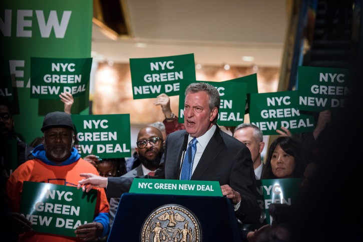 FILE - Mayor Bill de Blasio holds a press conference in the public plaza of Trump Tower to announce that under NYC’s Green New Deal, 8 Trump-owned properties in NYC will owe $2.1 million per year if he refuses to make climate change retrofits on Monday, May 13, 2019. Ed Reed/Mayoral Photography Office.