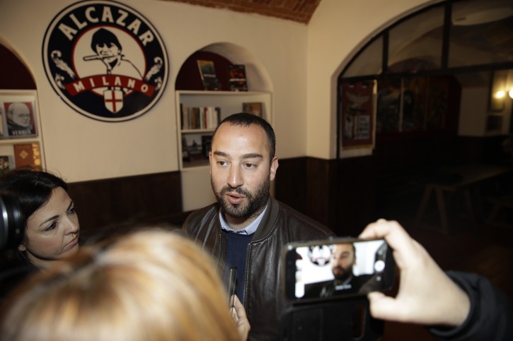 Francesco Polacchi, regional coordinator of Casapound extreme right political party, and founder of Altaforte publishing company, answers to reporters during a news conference, in Milan, Italy, Wednesday, May 8, 2019. Holocaust survivor, poet Halina Birenbaum, is set to open a book fair in Turin after the organizers agreed to demands that she and the Auschwitz-Birkenau state museum made to remove the stand of Altaforte publishing company.  (AP Photo/Luca Bruno)