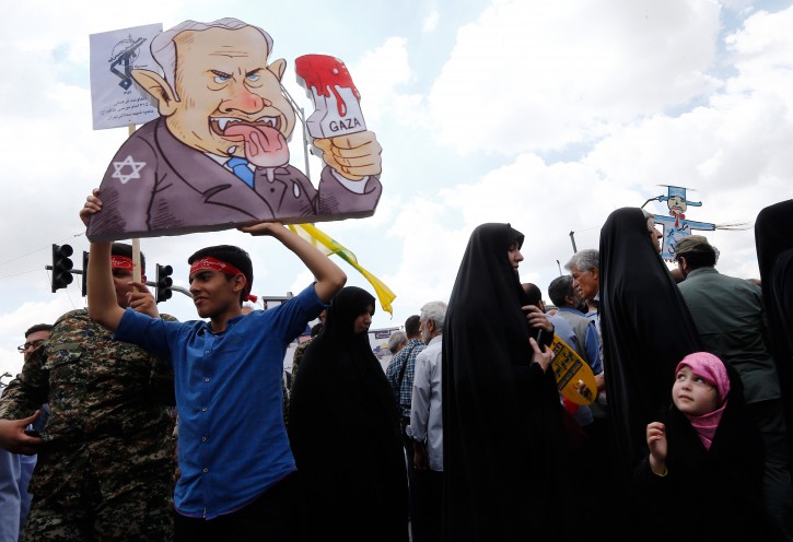  Iranians protesters hold on a cartoon of Israeli Prime Minister Benjamin Netanyahu during an anti-Israel rally mark Al Quds Day (Jerusalem Day), in support of Palestinian resistance against on the Israeli occupation, in Tehran, Iran, 31 May 2019. 