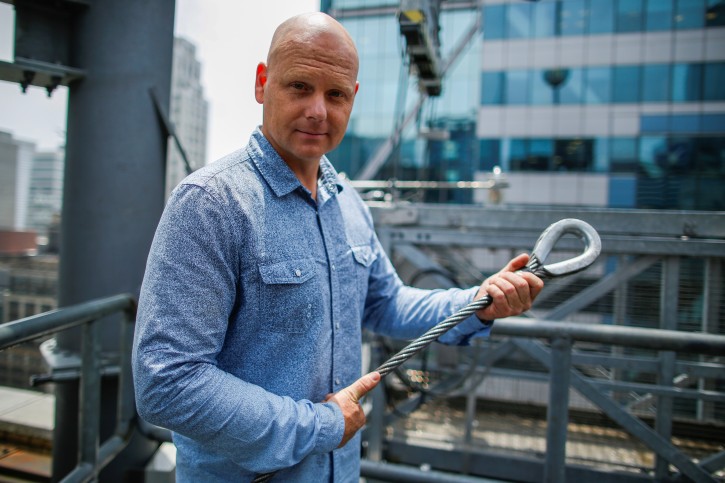 Aerialist Nik Wallenda holds a sample of a wire while he speaks with media as he prepares for a highwire walk over Times Square in New York, U.S., June 20, 2019.  REUTERS/Eduardo Munoz