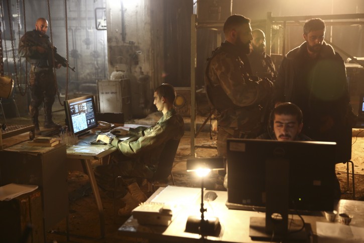 In this Thursday, May 30, 2019 photo, actors play their roles during a scene on the set of Israel's hit TV show "Fauda," in Tel Aviv, Israel. After two successful seasons, co-creators Avi Issacharoff and Lior Raz are hard at work on their much-anticipated third season, a good portion of which takes place in the Gaza Strip. The season debut date for the Netflix hit hasn't been revealed, but the trailer is being released this week. (AP Photo/Oded Balilty)