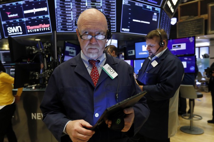 FILE - In this May 30, 2019, file photo trader John Doyle works on the floor of the New York Stock Exchange. (AP Photo/Richard Drew, File)