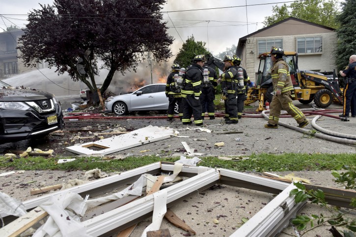 An explosion on Abbott Ave. in Ridgefield, N.J., brought mutual aid from surrounding towns to put out the fire on Monday, June 17, 2019. The lone person inside the residence apparently escaped serious injury. (Tariq Zehawi/The Record via AP)